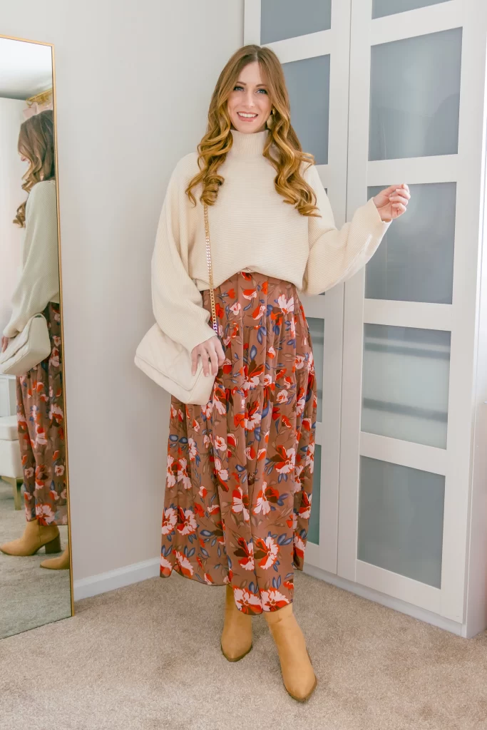 Spring Wedding Outfit Ideas: Sweater layered over a floral maxi dress